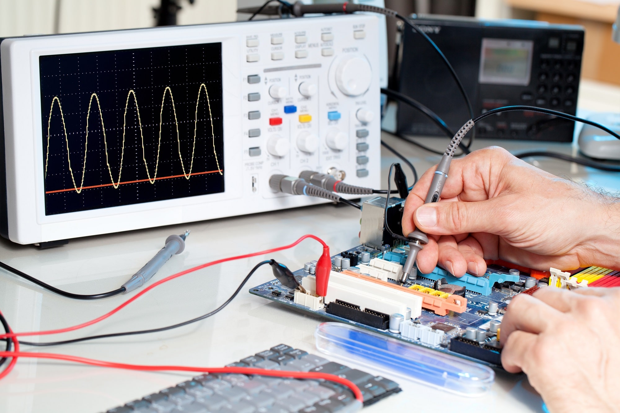 An oscilloscope and probes used to test electronic equipment