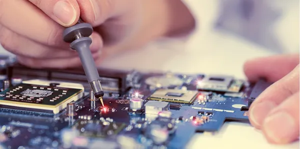 Close-up of electronic circuit-board servicing